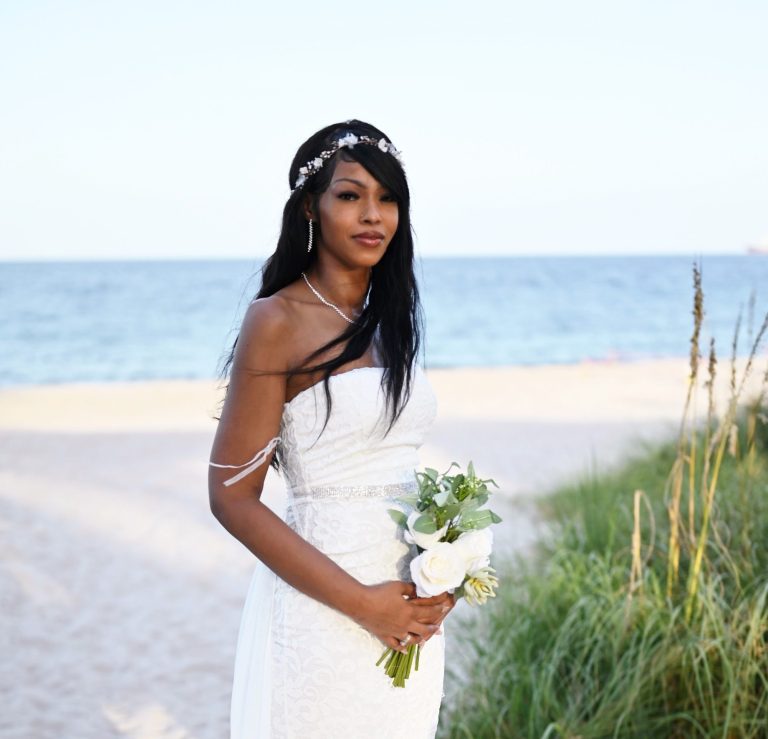 Bride & Mother of the Bride posing in front of wedding arch Mother of the bride & bride posing at Wedding Day Romance in Pinecrest Florida